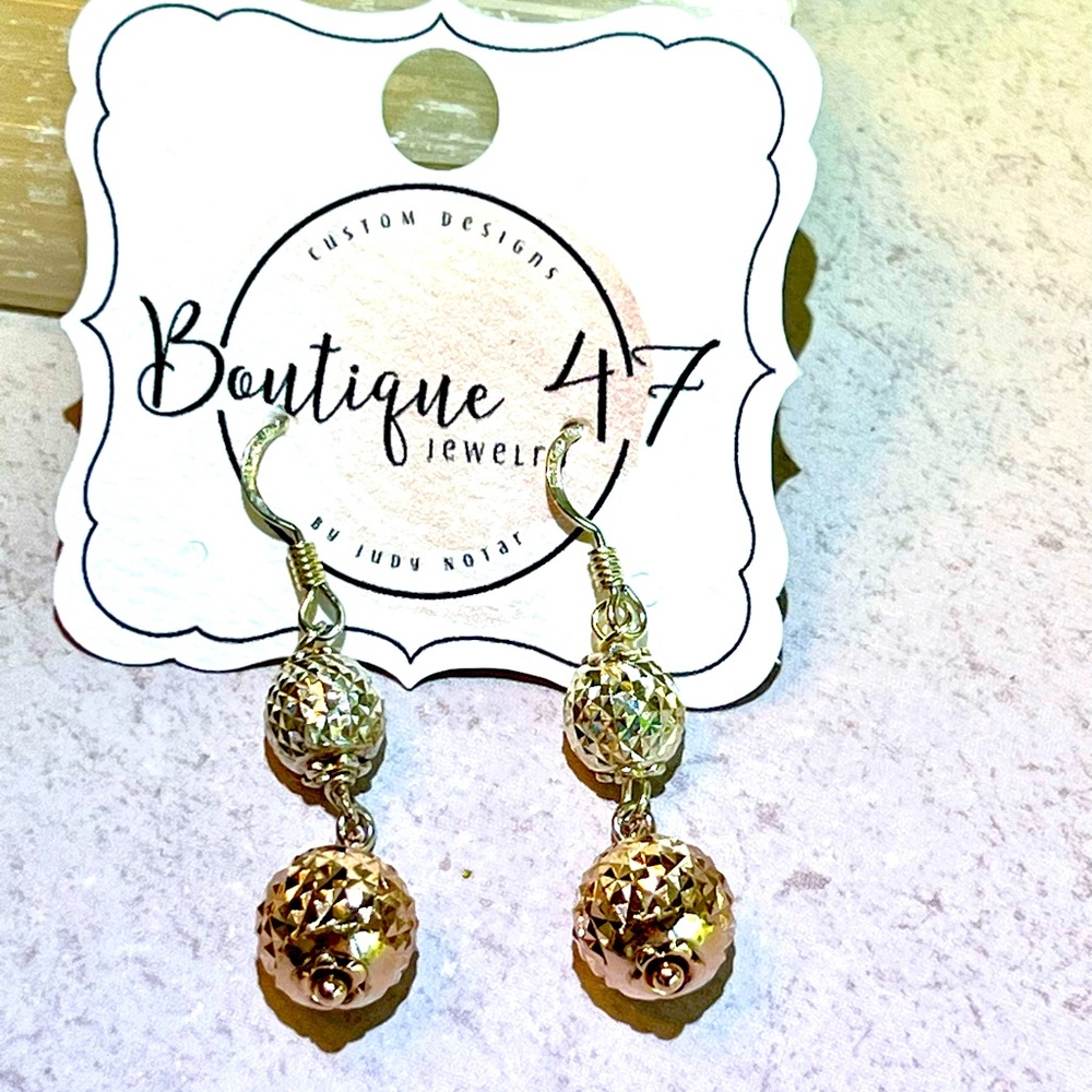 Sterling Silver drop earrings.